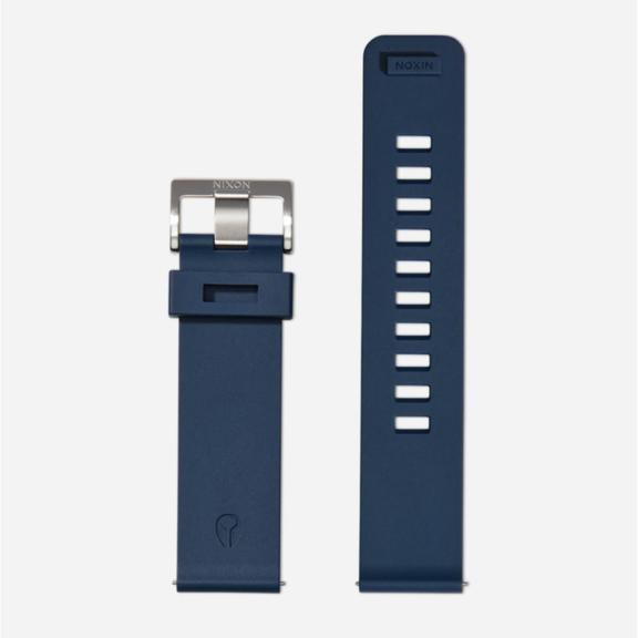 A dark blue rubber Nixon watch band.